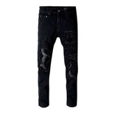 Vaqueros biker elásticos con parches negros